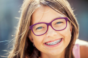 Young girl with braces.