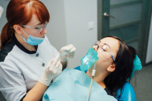 Dental sedation patient with dentist.